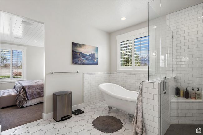 Full bath with a soaking tub, ensuite bathroom, a shower stall, recessed lighting, and tile patterned floors | Image 25