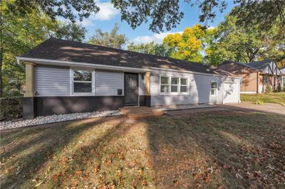 Single story home featuring a front lawn | Image 1