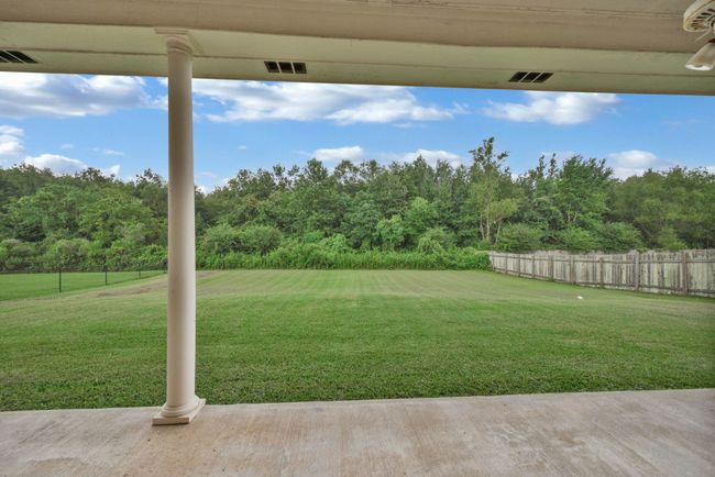 View of yard featuring a view of trees | Image 32