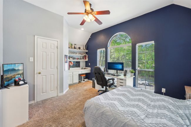 Bedroom 4 overlooks the front yard and has a huge closet and desk space. | Image 30