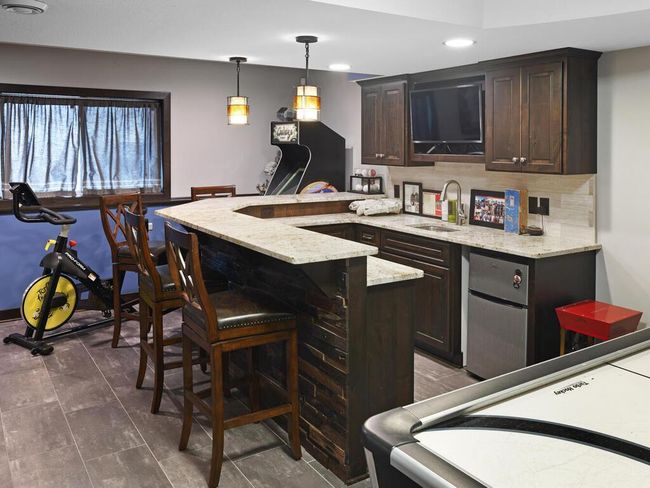 Wet bar/game area. Granite counters on the bar and one locking cabinet | Image 38