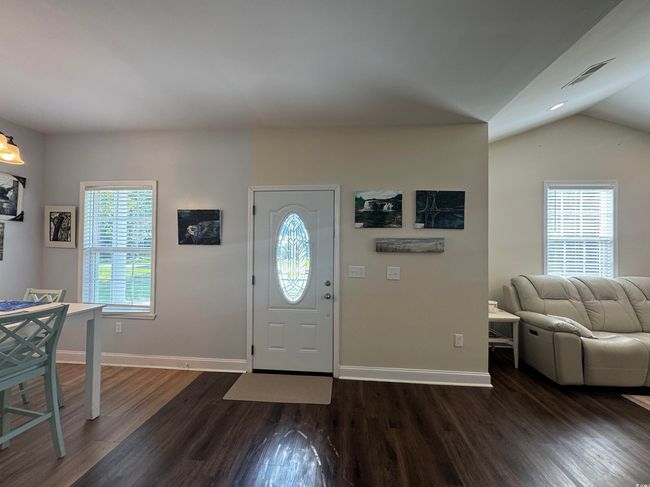 Entryway with dark wood-type flooring, baseboards, and lofted ceiling | Image 6