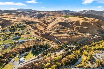 Welcome to 2091 Sleepy Hollow Road in Wenatchee, WA. Property touches the Wenatchee River and takes in all of the surrounding views. Lines are approximate and do not depict exact property lines. | Image 1