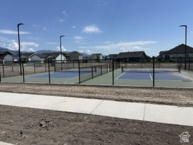 View of tennis court with a residential view | Image 11