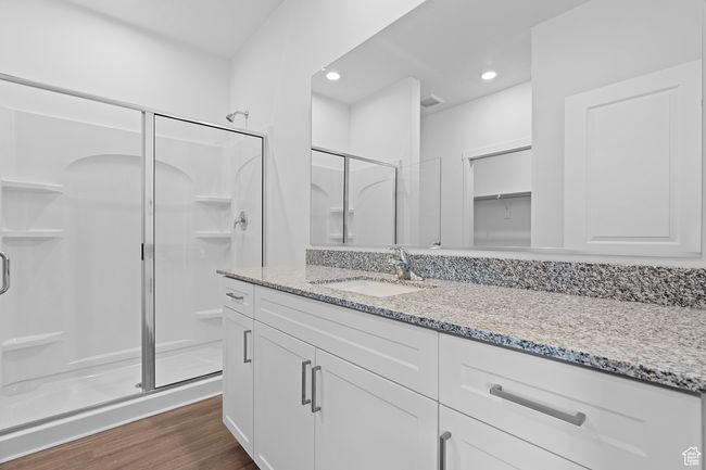 Bathroom with vanity, a stall shower, recessed lighting, visible vents, and wood finished floors | Image 7