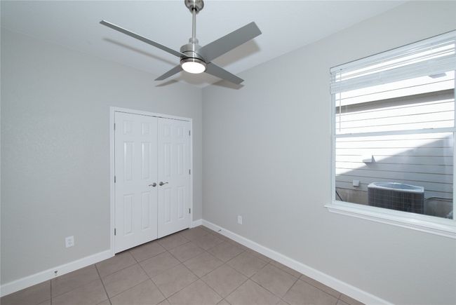 Bedroom 2 of 3 other side of room showing double door closet | Image 19
