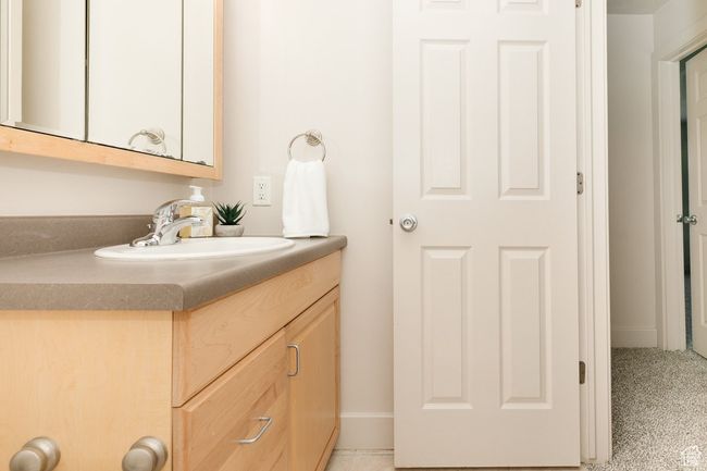 Bathroom featuring vanity and baseboards | Image 17