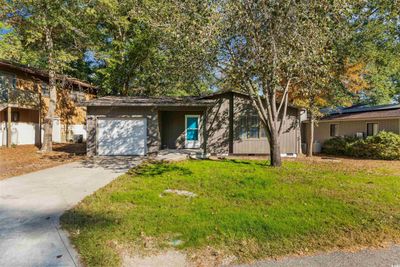 View of front of home with a front yard and a garage | Image 2