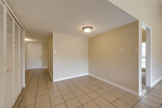 Unfurnished room featuring light tile patterned floors and baseboards | Image 10