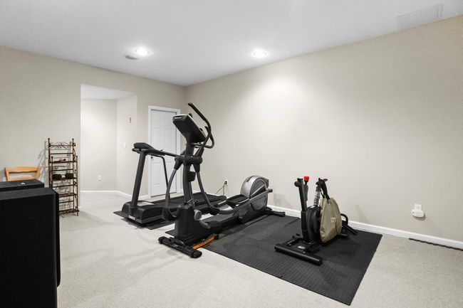 Stay fit year-round in the private home gym, located in the fully finished lower level with ample space for cardio and strength training. | Image 34