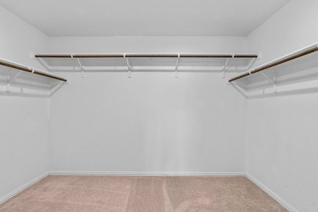 Walk in closet featuring carpet flooring | Image 18