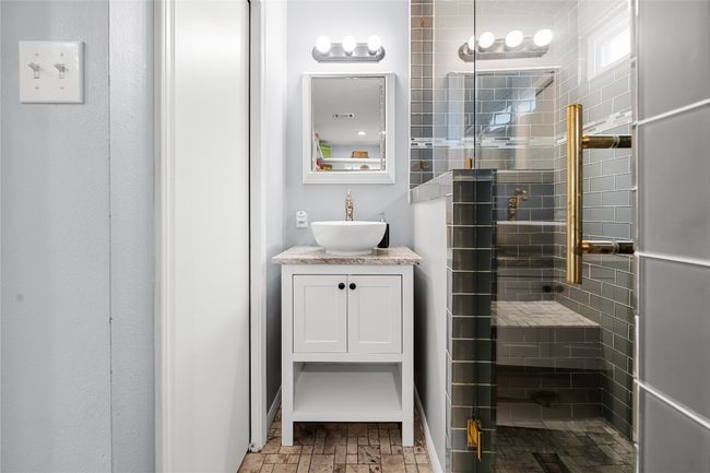 Bathroom featuring vanity and a beautiful glassed steam shower. A private toilet room is to the left! | Image 12