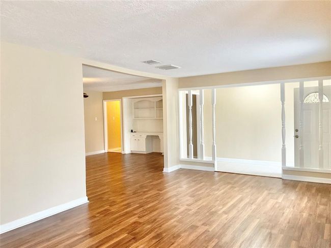 view from formal area into den | Image 5