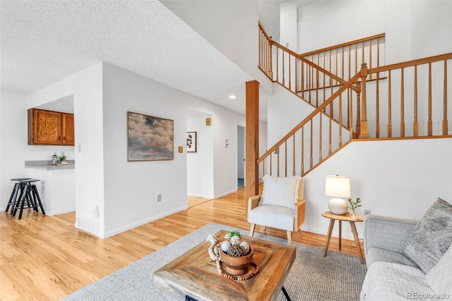 Living room looking toward kitchen and the stairs | Image 8