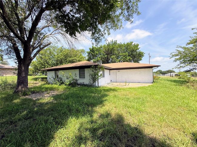 Rear view of property with a lawn and brick siding | Image 24