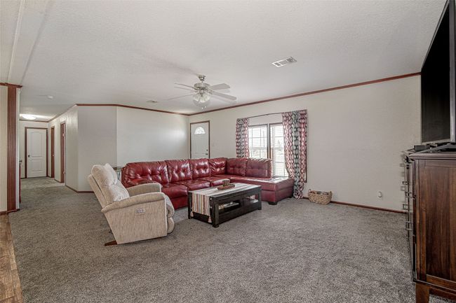 Main house - view ov living area from primary bedroom doorway | Image 5