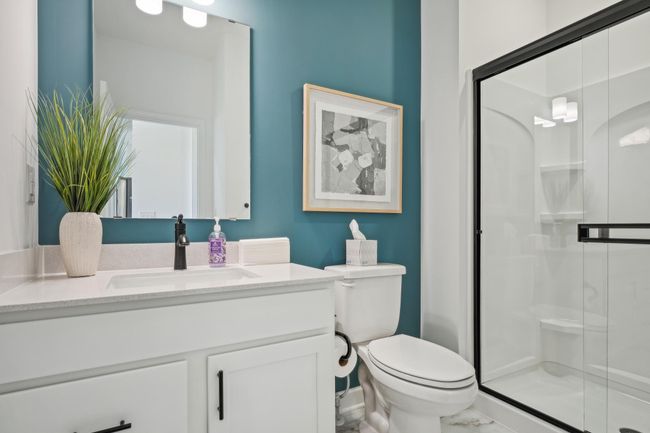 Photo is of the actual model. The main level bath. | Image 11