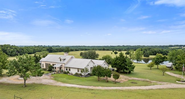 Aerial view of property and surrounding area featuring a large body of water | Image 5