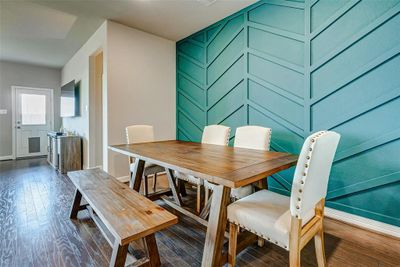 Designated dining area with beautiful accent wall | Image 3