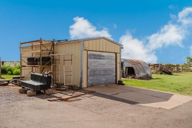 Detached garage with asphalt driveway | Image 30
