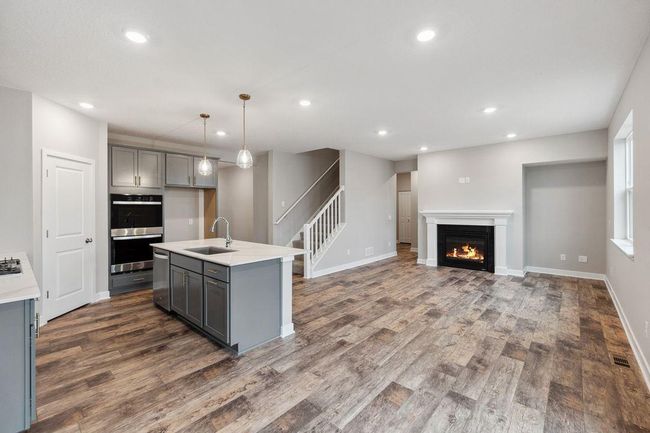 Open concept plan with electric fireplace (not shown). Model photo. Options and colors will vary. | Image 6