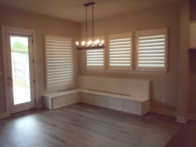Unfurnished dining area with light wood-style flooring and a chandelier | Image 19