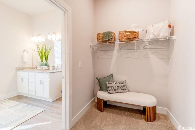 View of walk in closet | Image 12