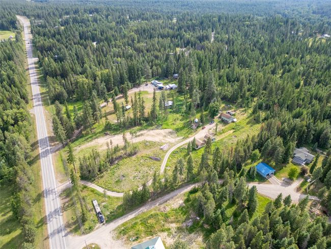 Aerial overview of property's location featuring a forest | Image 28