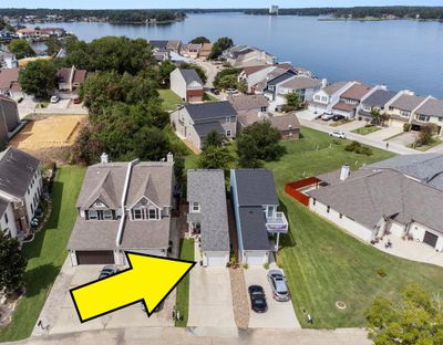 This detached home features wood-look tile flooring throughout most of the home. Beautiful stone detailing on the garage. Click on the movie reel icon or visit our on-line documents for a QR code to view our walk-through video. | Image 3