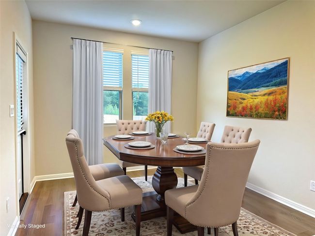 Dining room with LVP floors, baseboards, and recessed lighting | Image 5