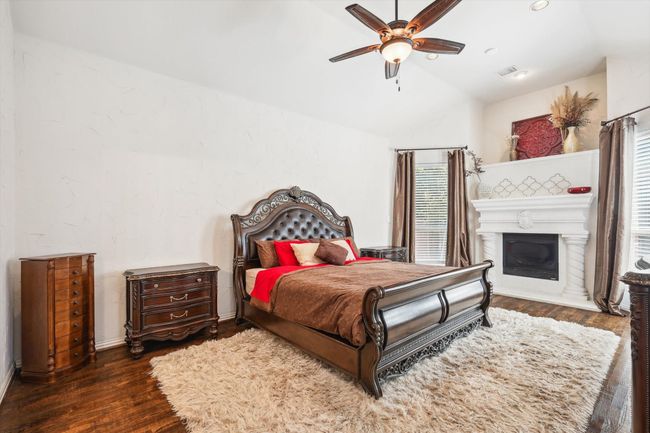 Primary Bedroom featuring with wood floors and fireplace | Image 13