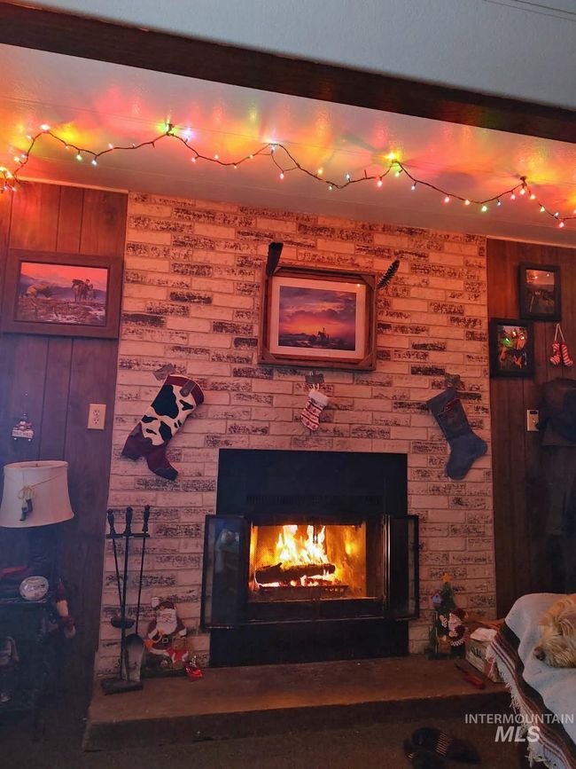 Detailed view of wood walls and a large fireplace | Image 23