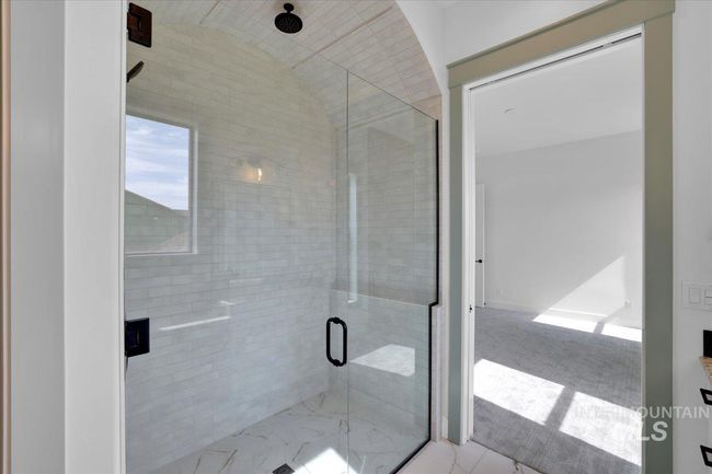 Bathroom with a shower stall and vaulted ceiling | Image 30