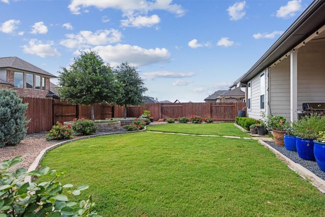 View of fenced backyard | Image 27