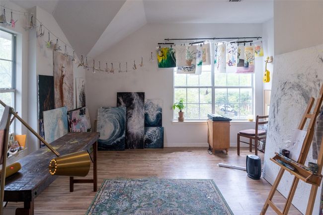 Sitting room featuring plenty of natural light, wood finished floors, and lofted ceiling | Image 31