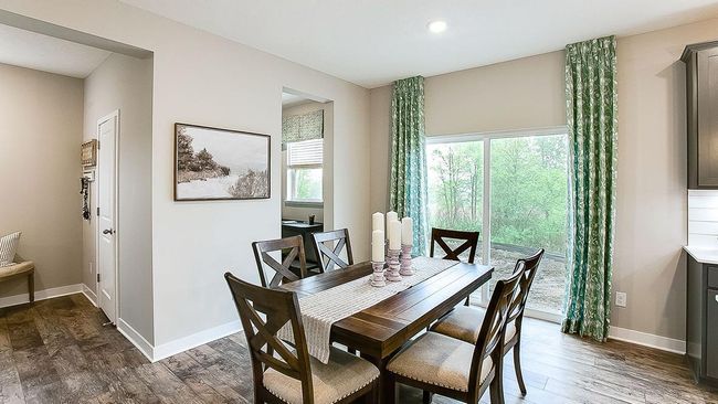 Informal/everyday dining space resides directly adjacent to kitchen. Command center space (next to sliding door) could be using for additional office/desk space, as a bar area, or even a dedicated space for your pooch! The options are endless! | Image 15