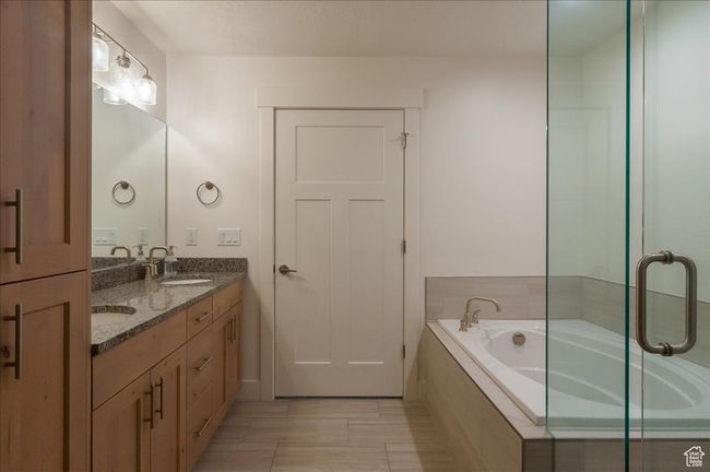 Full bath featuring double vanity and a garden tub | Image 20