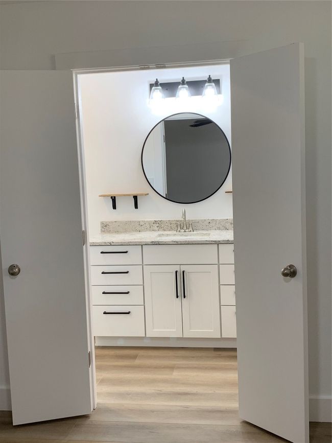 Bathroom featuring vanity and wood finished floors | Image 15
