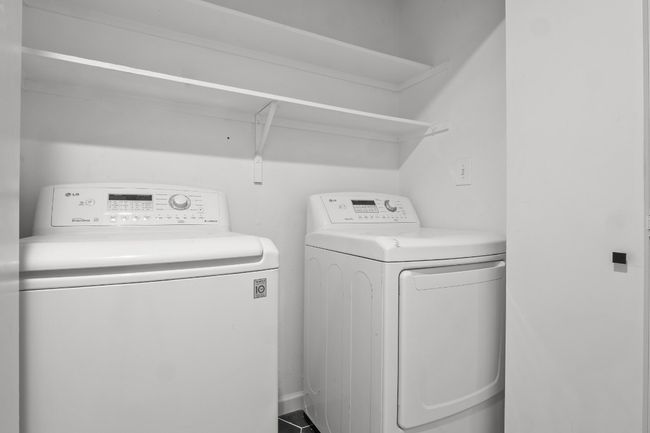 Laundry area featuring laundry area and washer and clothes dryer | Image 18