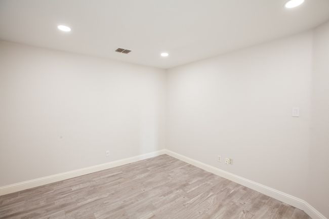 Unfurnished room featuring light wood-style floors and recessed lighting | Image 32
