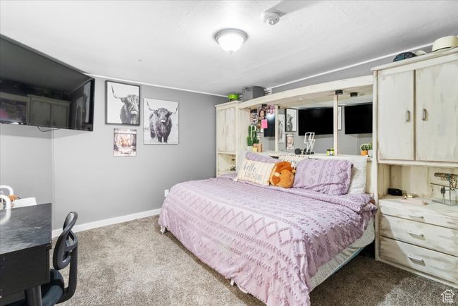 Bedroom with baseboards and carpet flooring | Image 41