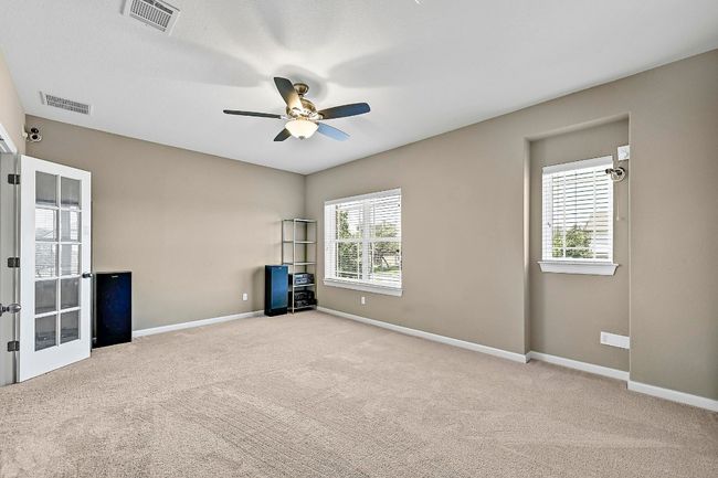 Media room featuring carpet floors and ceiling fan | Image 25