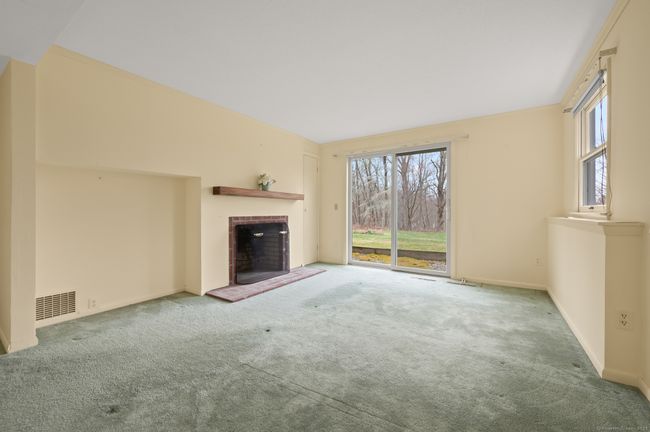 Lower level has fireplace and sliders to back yard. | Image 26