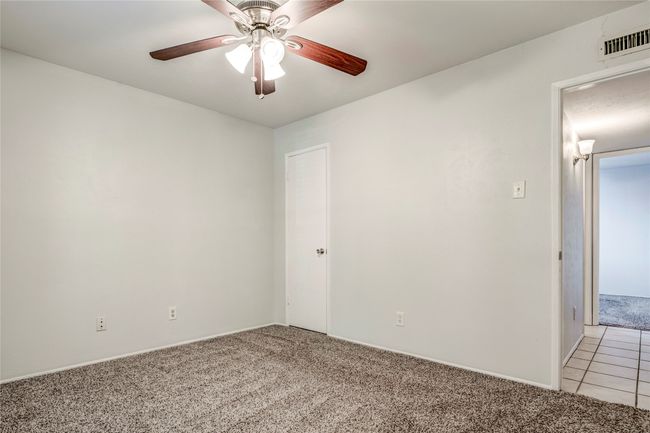 Spare room with light colored carpet and a ceiling fan | Image 32