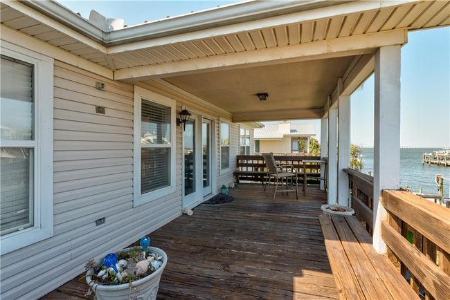 Wooden deck with a water view | Image 44