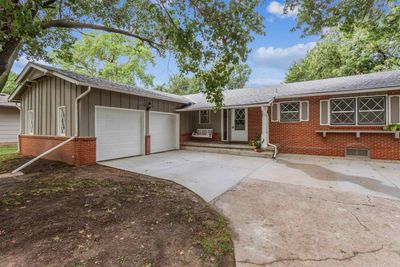 Single story home with a garage | Image 1