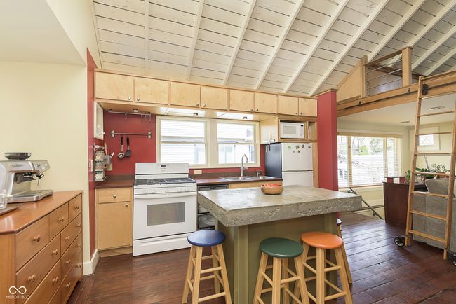 Another view of the kitchen with the vaulted ceilings. | Image 10