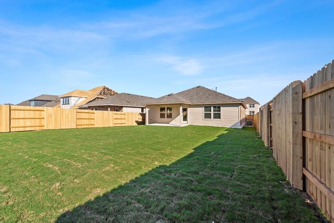 Back of house with a yard, a fenced backyard, and a patio area | Image 27