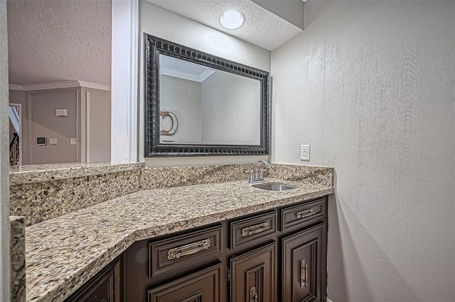 Chic wet bar adjacent to the living room, perfect for entertaining. | Image 24