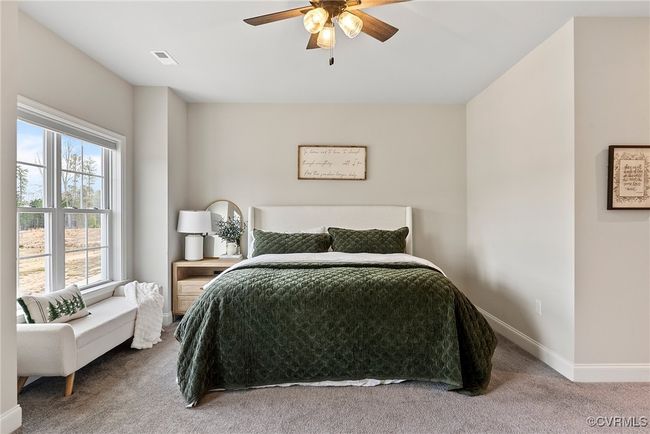 Bedroom with ceiling fan, carpet floors, and multiple windows | Image 22